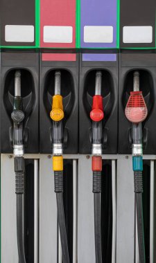 refueling nozzles close-up with diesel gasoline, gas and other fuels, vertical