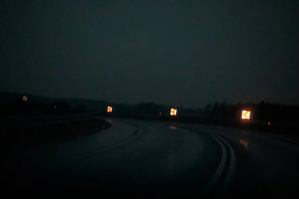 Sharp Turn Signposts Rainy Night Slippery Road — 图库照片