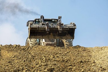 empty escalator bucket in a quarry. Global construction. Mining.