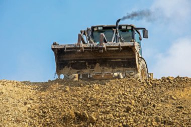 empty escalator bucket in a quarry. Global construction. Mining.