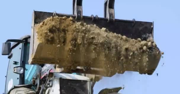 Tractor Full Bucket Soil Pours Soil Ravine Sunny Hot Day — Stock video