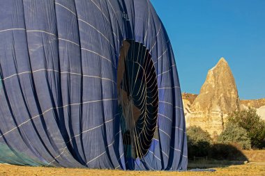hot air balloon landed on the ground in Cappadocia, on the goreme 