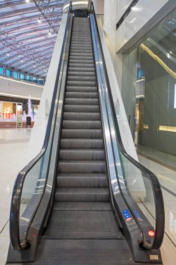 empty escalator in the mall without people. Modern interior