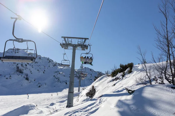 Chairlift at mountain ski resort on sunny day — Stock Photo, Image