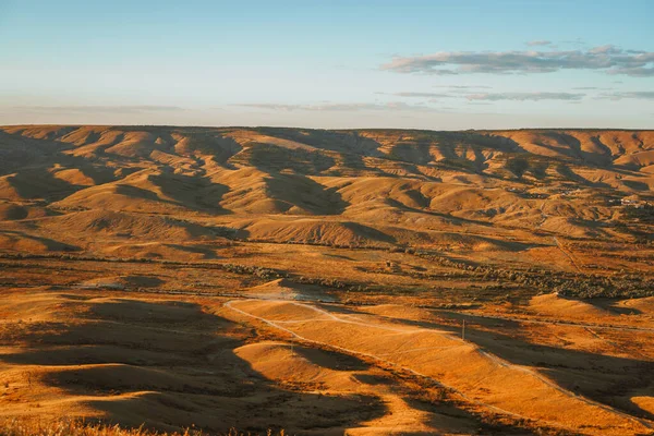 Amazing sunset landscape of the valley with hills photographed from the top of the mountain.