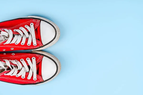 Red Sneakers Blue Background Minimalism — стоковое фото