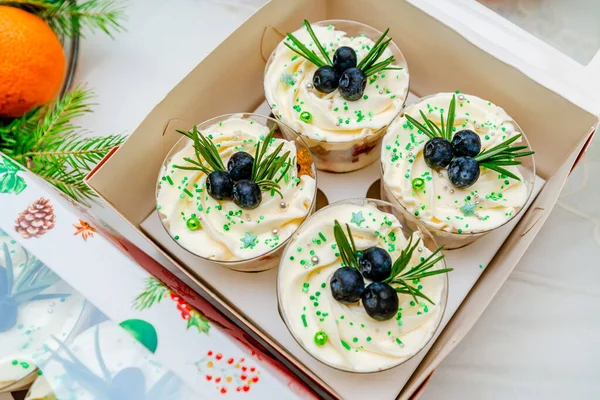 Christmas trifles cakes in a glass in a box