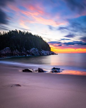 Sunrise over an ocean beach in Canada clipart