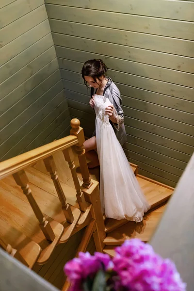 Bride Bathrobe White Dress Her Hands Climbs Stairs — Zdjęcie stockowe