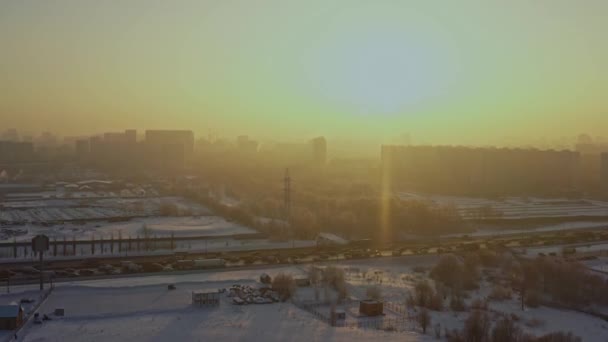 The cityscape on a very bright sunny day in winter. Aerial view — Wideo stockowe