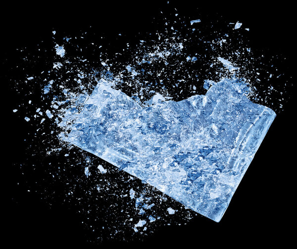 Collision explosion of blue ice on black background