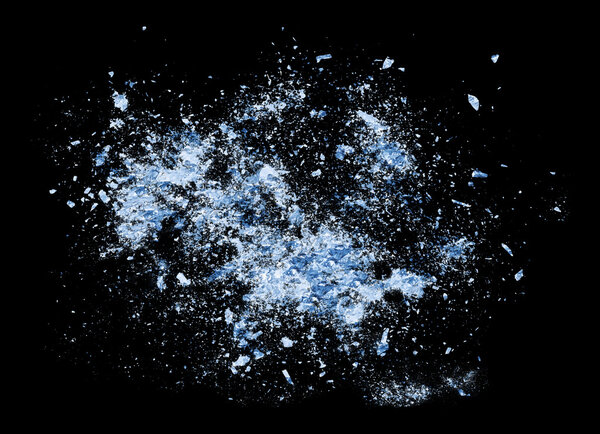 Collision explosion of blue ice on black background