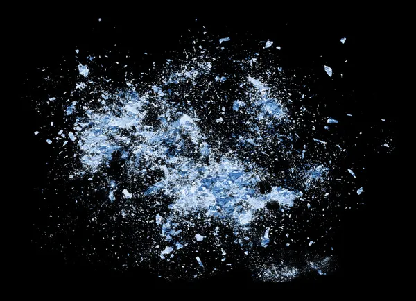 Kollision explosion av blå is på svart bakgrund Royaltyfria Stockfoton