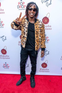 Shaka Smith attends Natasha Graziano's book launch party 