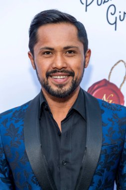 Joel Relampagos attends Natasha Graziano's book launch party 