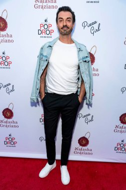 Todd Savvas attends Natasha Graziano's book launch party 