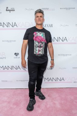 Garrett Grant attends  Manna Kadar Celebrity Pink Carpet Celebrating BAZAAR Cover Release 2022 at Hotel Laguna, Laguna Beach, CA on August 9, 2022