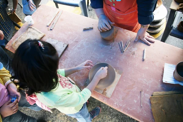 Children engaged in creative work at  Pottery Festival — Stock Photo, Image