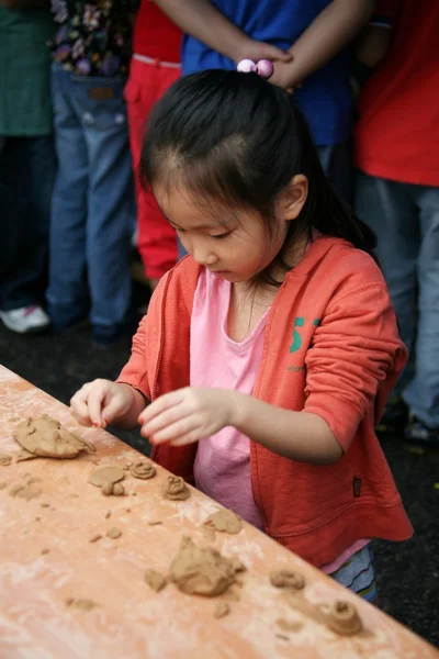 Children engaged in creative work at  Pottery Festival — Stock Photo, Image