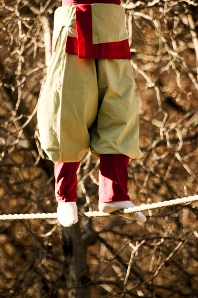 Man walking on a tightrope — Stock Photo, Image