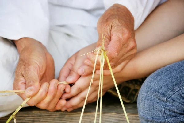 People making traditional footwear sandals — Stock Photo, Image