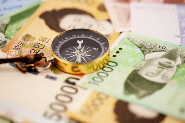 South Korean Won currency with compass — Stock Photo, Image