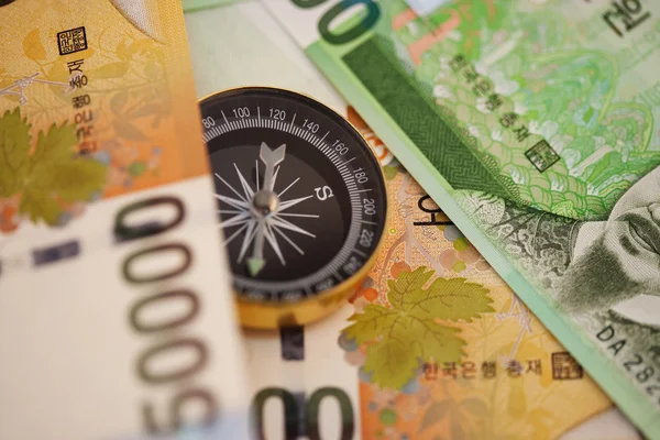 South Korean Won currency with compass — Stock Photo, Image