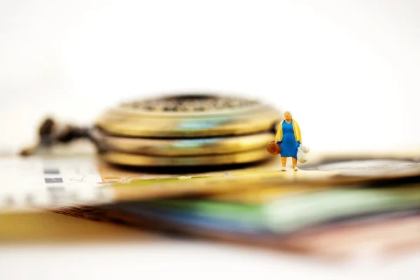 Petite figure and pocket watch — Stock Photo, Image