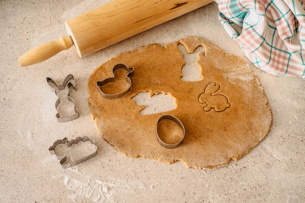 Easter baking flat lay.Spring symbols made from gingerbread.Homemade cookies.Easter bunny,rabbit,eggs and ducks from delicious honey dough.Happy Easter.Top View Food.Holiday celebration decorations.
