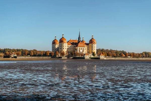 View of fairy tale Moritzburg Castle in Saxony,Germany.Magnificent baroque palace in middle of large pond and park.Popular location for Czech fairy tale movie Three Nuts for Cinderella