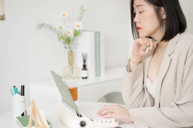 asian business and writer woman meeting online and typing by use retro keyboard and tablet