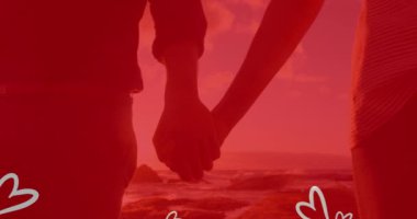 Kumsalda el ele tutuşan beyaz kalplerin canlandırması. bağlılık, evlilik, romantizm ve aşk konsepti dijital olarak oluşturulmuş video.