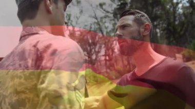 Askerler üzerinde Alman bayrağının animasyonu. küresel vatanseverlik, silahlı kuvvetler ve koruma kavramı dijital olarak oluşturulmuş video.