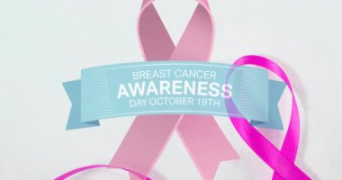 Göğüs kanseri farkındalığının animasyonu ve beyaz arka planda pembe kurdele. Göğüs kanseri pozitif farkındalık kampanyası konsepti dijital olarak üretildi.