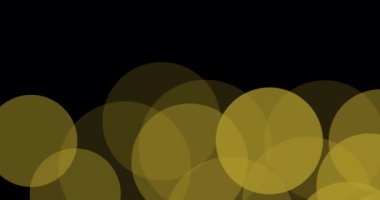 Siyah arkaplanda süzülen ışık lekelerinin canlandırması. parti ve kutlama konsepti dijital olarak oluşturulmuş video.