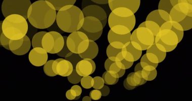 Siyah arkaplanda süzülen ışık lekelerinin canlandırması. parti ve kutlama konsepti dijital olarak oluşturulmuş video.