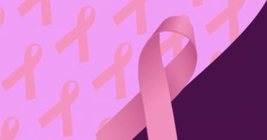 Mor arka planda pembe kurdelelerin animasyonu. Göğüs kanseri pozitif farkındalık kampanyası konsepti dijital olarak üretildi.