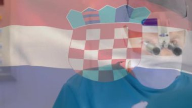 Ameliyathanede cerrahların üzerinde sallanan Hırvat bayrağının animasyonu. küresel tıp, covid 19 pandemik konsept sırasında sağlık hizmetleri dijital olarak üretilen video.