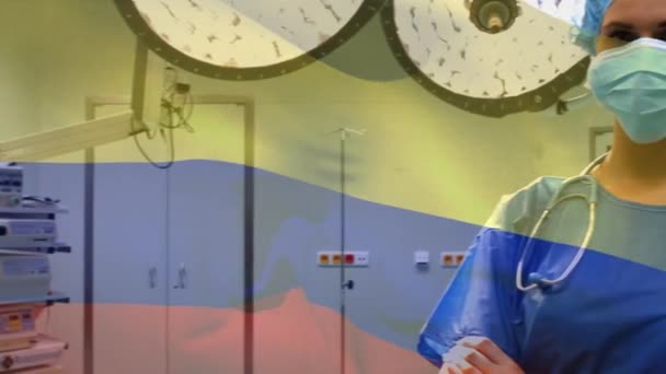 Animación Bandera Colombia Ondeando Sobre Anestesiólogo Quirófano Medicina Global Servicios — Vídeo de stock