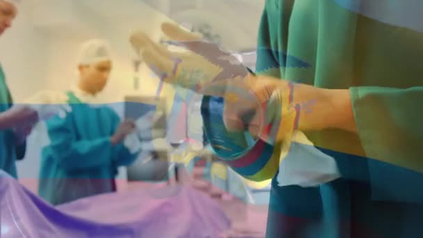 在手术室里 在外科医生面前挥动着厄瓜多尔国旗的动画 全球医学 围产期保健服务 数码制作的19种流行病概念视频 — 图库视频影像