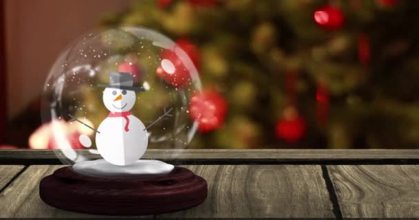 Animation Snow Globe Snowman Wooden Table Christmas Tree Christmas Tradition — Stock Video
