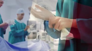 Ameliyathanede cerrahların üzerinde sallanan Fransa bayrağının animasyonu. küresel tıp, covid 19 pandemik konsept sırasında sağlık hizmetleri dijital olarak üretilen video.