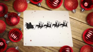 Kırmızı parçacıklar, Noel Baba 'nın kızağındaki kırmızı parçacıklar ren geyikleri tarafından bir kağıt ve çoklu takılar üzerinde çekiliyor. Noel şenliği ve kutlama konsepti