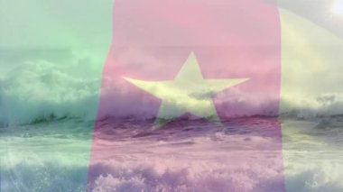Denizde dalgalara karşı kamerun bayrağı sallamanın dijital bileşimi. Ulusal turizm ve seyahat kavramı