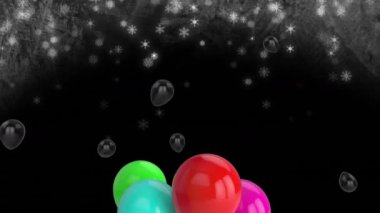 Siyah zemin üzerinde uçuşan renkli balonların animasyonu. Yeni yıl partisi, noel ve kutlama konsepti dijital olarak oluşturulmuş video.