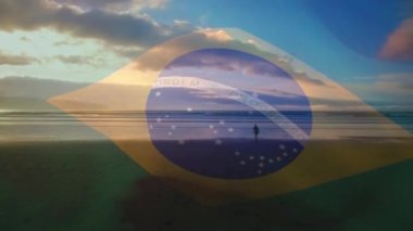 Sahilde yürüyen adama Brezilya bayrağı sallamanın dijital bileşimi. Ulusal turizm ve seyahat kavramı