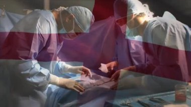 Ameliyathanede cerrahlar yerine İngiltere bayrağının canlandırılması. küresel tıp, covid 19 pandemik konsept sırasında sağlık hizmetleri dijital olarak üretilen video.