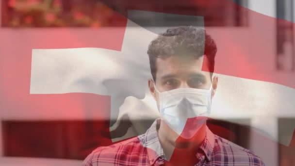 Animering Flaggan Switzerland Vinka Över Mannen Bär Ansiktsmask Covid Pandemi — Stockvideo