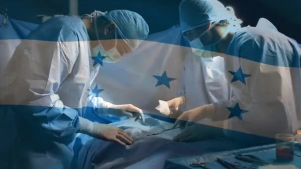 Animación Bandera Honduras Ondeando Sobre Cirujanos Quirófano Medicina Global Servicios — Vídeo de stock