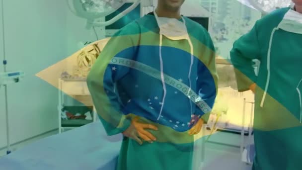 在外科医生头上挥动着的巴西国旗的动画 全球联盟19大流行病和保健服务概念数字制作视频 — 图库视频影像
